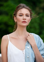 Load image into Gallery viewer, Unique diamond gold earrings with three naked diamonds